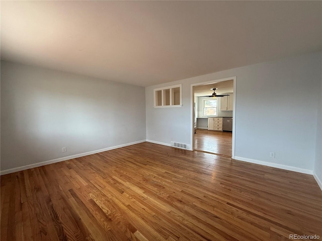 4670 Independence St, Wheat Ridge, CO 80033 - unfurnished room with dark wood finished floors and baseboards