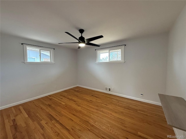 4670 Independence St, Wheat Ridge, CO 80033 - unfurnished room featuring baseboards, a ceiling fan, and wood finished floors