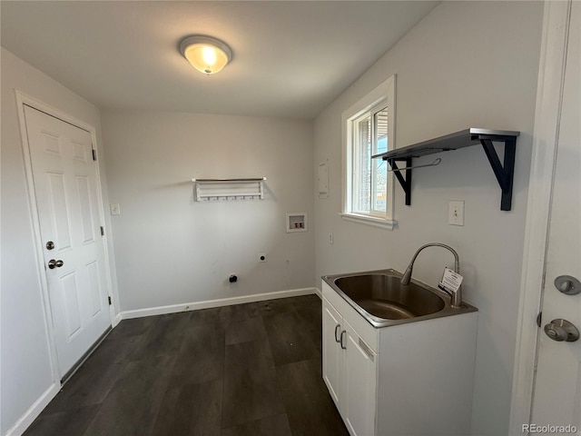 4670 Independence St, Wheat Ridge, CO 80033 - laundry area featuring cabinet space, hookup for an electric dryer, dark wood-style flooring, hookup for a washing machine, and baseboards