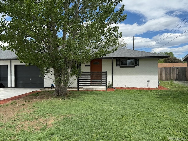 4670 Independence St, Wheat Ridge, CO 80033 - view of front of house featuring brick siding, roof with shingles, concrete driveway, and an attached garage