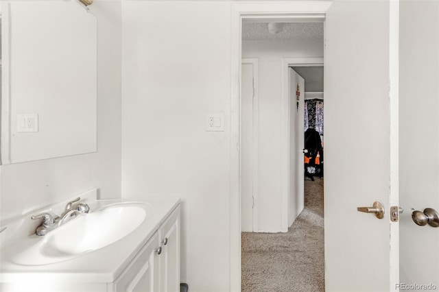 bathroom with vanity and a textured ceiling