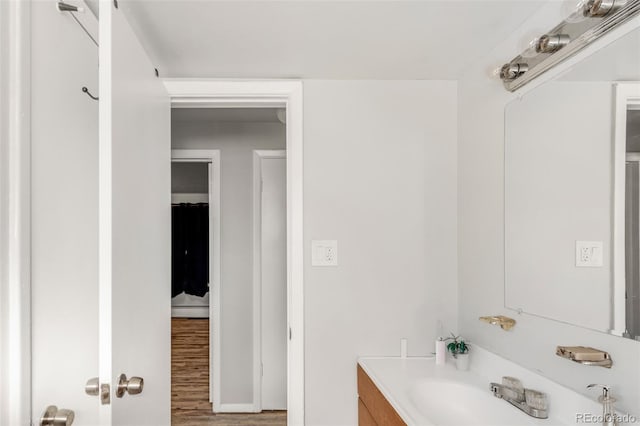 bathroom featuring vanity and hardwood / wood-style floors