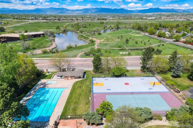 aerial view featuring a water and mountain view