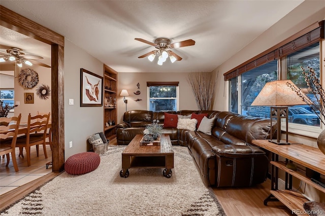 5900 W 62nd Ave, Arvada, CO 80003 - living room with a ceiling fan and light wood finished floors