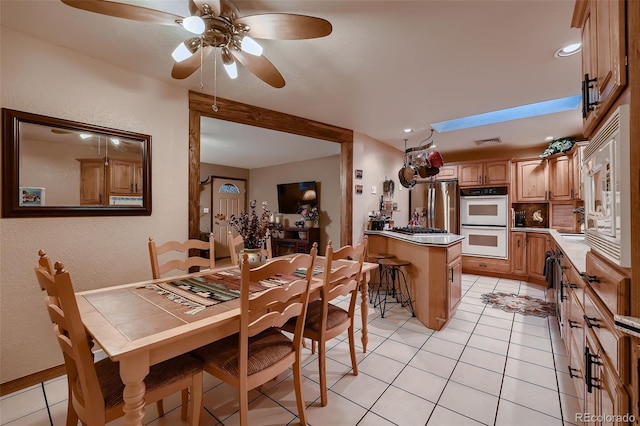 5900 W 62nd Ave, Arvada, CO 80003 - dining room featuring ceiling fan, light tile patterned floors, recessed lighting, and a textured wall