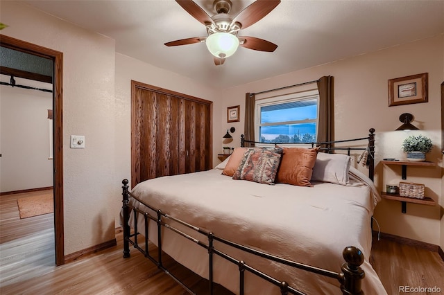 5900 W 62nd Ave, Arvada, CO 80003 - bedroom featuring wood finished floors, a closet, and a ceiling fan