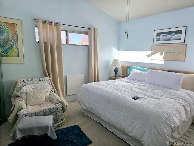 bedroom with carpet flooring and vaulted ceiling