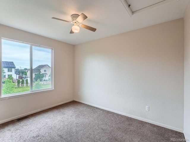 5553 Jasper St, Denver, CO 80239 - carpeted spare room with ceiling fan and baseboards