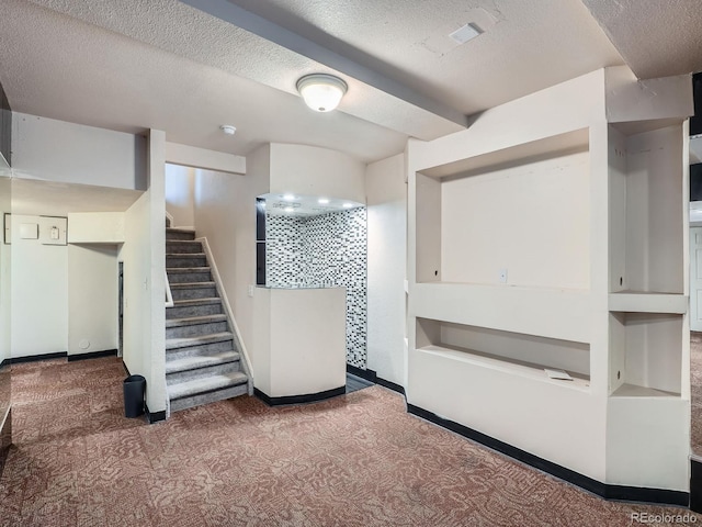 5553 Jasper St, Denver, CO 80239 - staircase with carpet and a textured ceiling