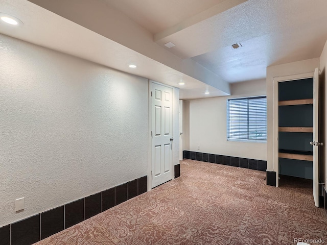 5553 Jasper St, Denver, CO 80239 - basement featuring recessed lighting, carpet flooring, and a textured ceiling