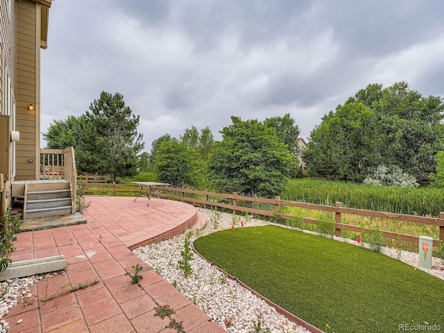 5553 Jasper St, Denver, CO 80239 - view of yard with a patio