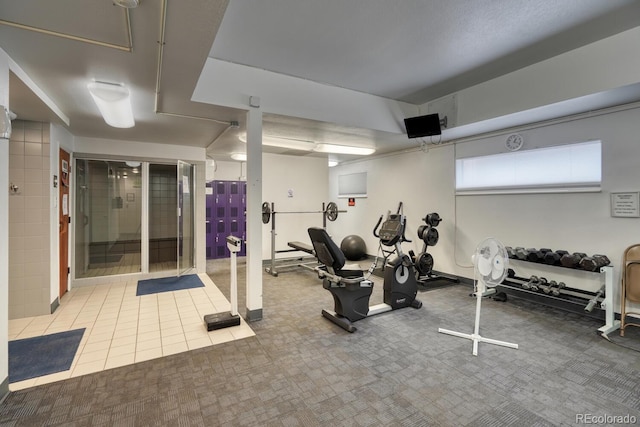 workout area featuring tile patterned floors