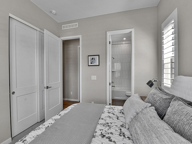 11464 Stonewash St, Littleton, CO 80125 - bedroom featuring multiple windows, ensuite bathroom, a closet, and baseboards