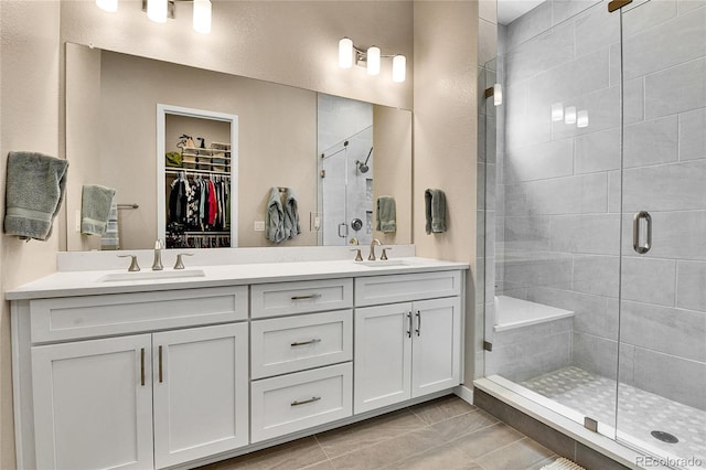 11464 Stonewash St, Littleton, CO 80125 - full bath featuring a stall shower, double vanity, and a spacious closet