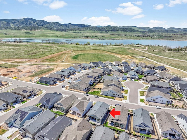 11464 Stonewash St, Littleton, CO 80125 - aerial view of residential area with a water and mountain view