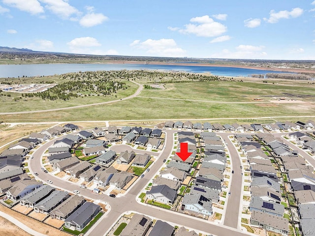 11464 Stonewash St, Littleton, CO 80125 - aerial overview of property's location with a large body of water and nearby suburban area