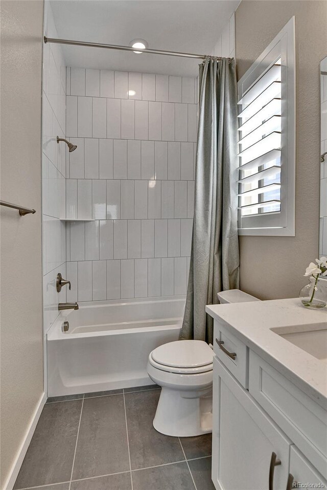 11464 Stonewash St, Littleton, CO 80125 - full bath with tile patterned flooring, toilet, shower / bath combination with curtain, and vanity