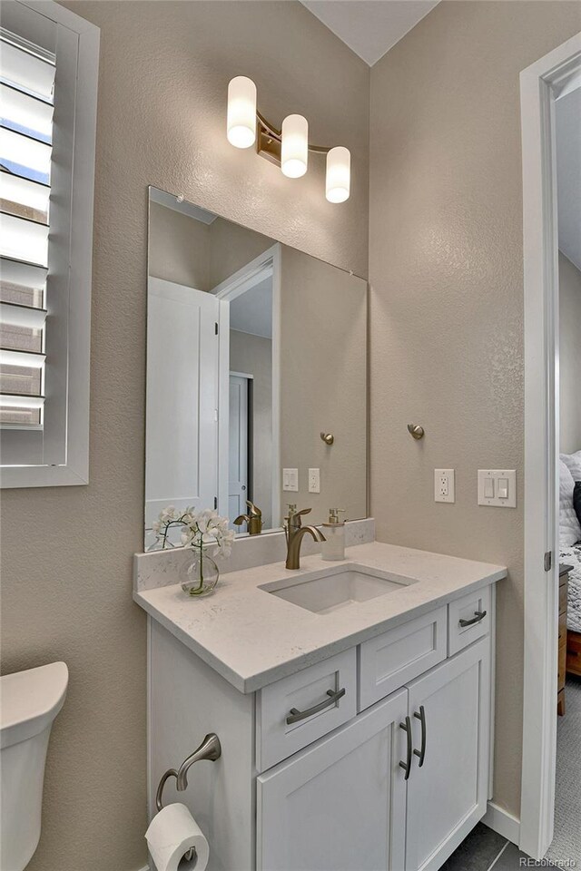 11464 Stonewash St, Littleton, CO 80125 - ensuite bathroom with toilet and vanity