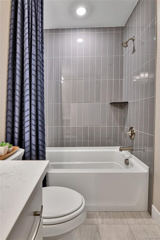 11464 Stonewash St, Littleton, CO 80125 - full bathroom featuring shower / bath combination with curtain, toilet, a textured ceiling, and vanity