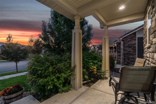 view of patio terrace at dusk