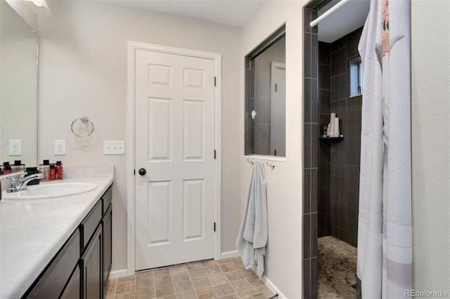 bathroom featuring vanity and a shower with shower curtain