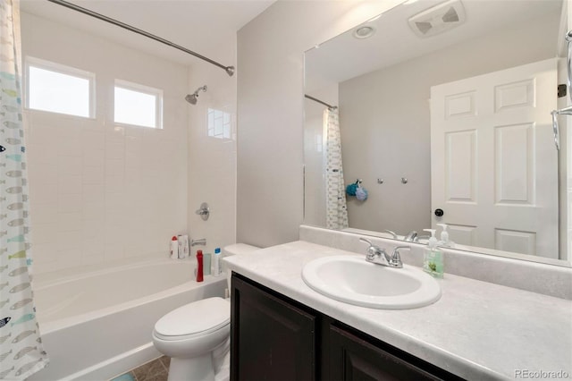 full bathroom with vanity, toilet, and shower / bath combo with shower curtain