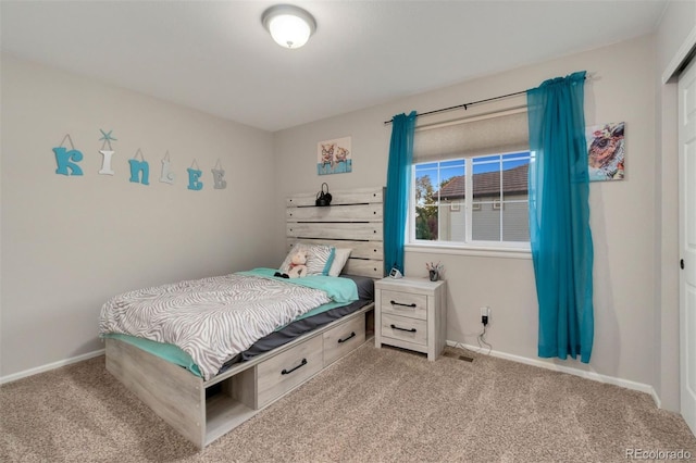 bedroom with light carpet