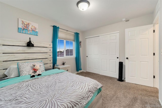 bedroom with carpet floors and a closet