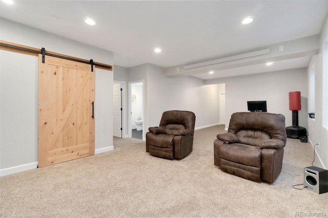 carpeted living room with a barn door