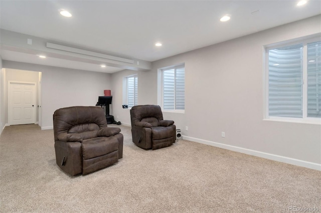 sitting room with light colored carpet