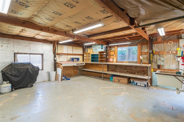 916 Glen Heather Ct, Dacono, CO 80514 - garage featuring a workshop area