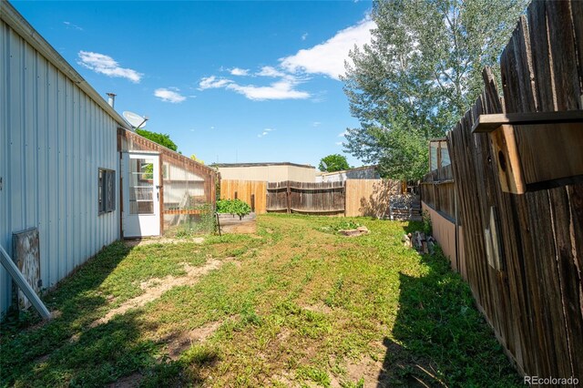 916 Glen Heather Ct, Dacono, CO 80514 - fenced backyard featuring an exterior structure