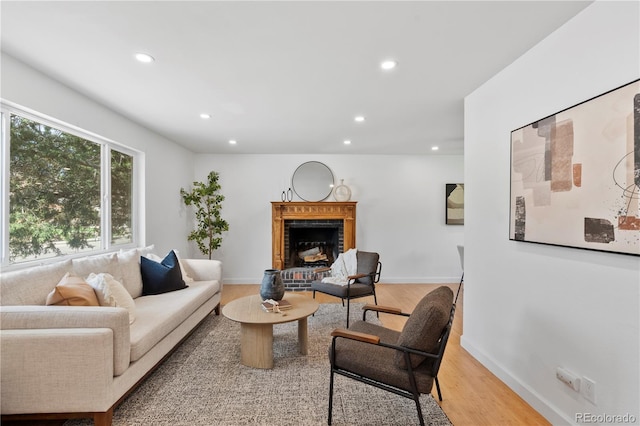 9123 W Arbor Ave, Littleton, CO 80123 - living room featuring recessed lighting, light wood finished floors, and a brick fireplace