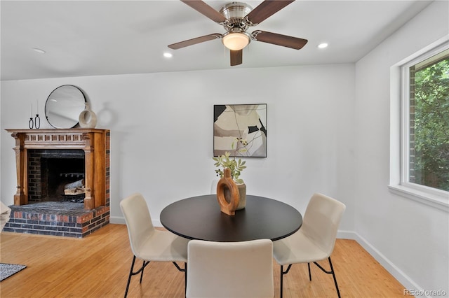 9123 W Arbor Ave, Littleton, CO 80123 - dining space featuring wood finished floors, a fireplace, ceiling fan, and recessed lighting
