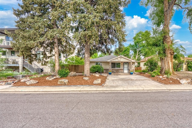 404 S Jasmine St, Denver, CO 80224 - view of front of house with driveway and stone siding