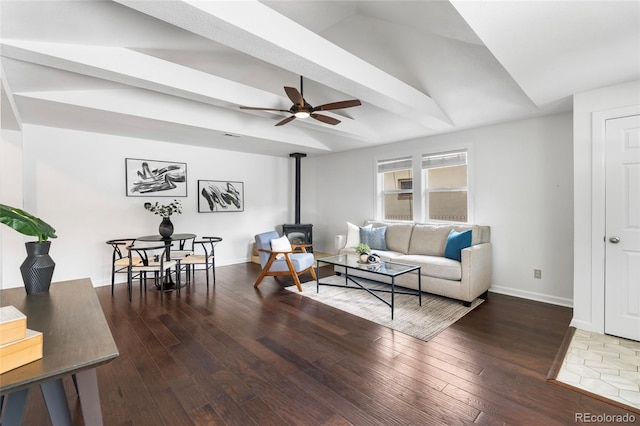 404 S Jasmine St, Denver, CO 80224 - living room featuring a wood stove, ceiling fan, hardwood / wood-style floors, baseboards, and vaulted ceiling