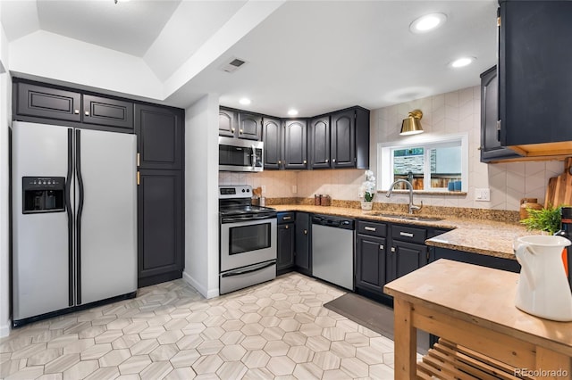 404 S Jasmine St, Denver, CO 80224 - kitchen featuring stainless steel appliances, a sink, backsplash, recessed lighting, and light stone counters