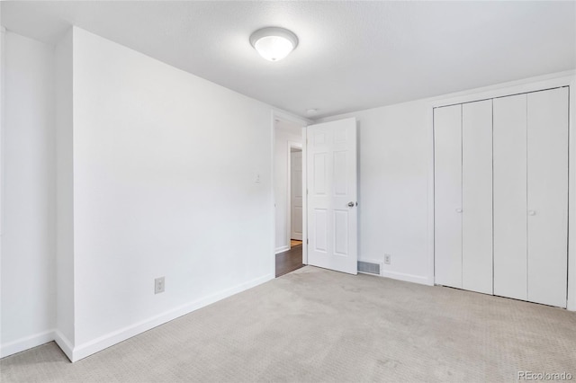 404 S Jasmine St, Denver, CO 80224 - unfurnished bedroom with carpet flooring, baseboards, and a closet