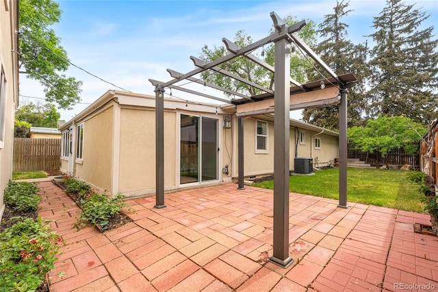 404 S Jasmine St, Denver, CO 80224 - back of property with a pergola, cooling unit, stucco siding, and a patio