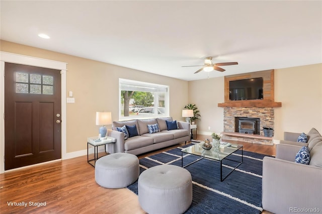 4293 Graham Ct, Boulder, CO 80305 - living area with wood finished floors, ceiling fan, baseboards, a stone fireplace, and recessed lighting