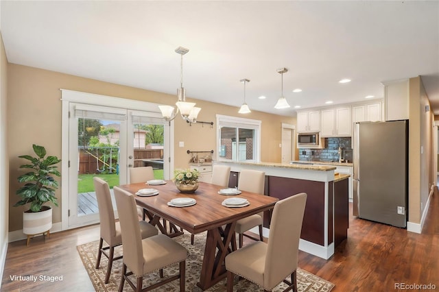 4293 Graham Ct, Boulder, CO 80305 - dining room featuring dark wood-style floors, a chandelier, recessed lighting, and baseboards