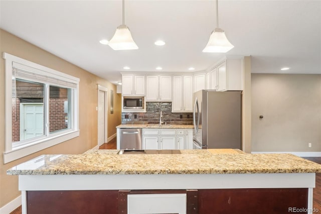 4293 Graham Ct, Boulder, CO 80305 - kitchen with appliances with stainless steel finishes, baseboards, white cabinets, backsplash, and recessed lighting