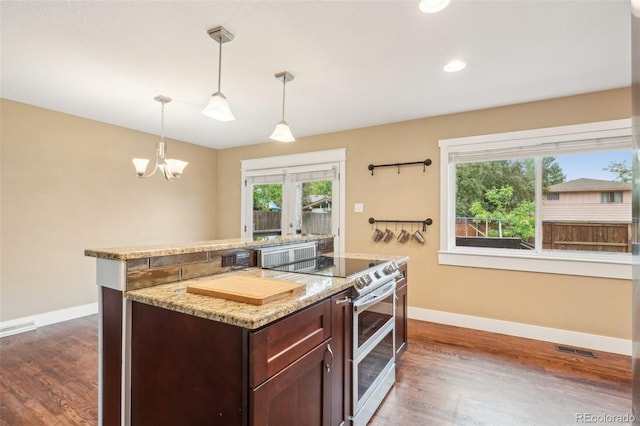 4293 Graham Ct, Boulder, CO 80305 - kitchen with range with two ovens, baseboards, dark wood-style flooring, and recessed lighting