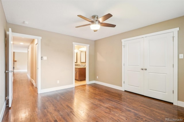 4293 Graham Ct, Boulder, CO 80305 - unfurnished bedroom with dark wood finished floors, baseboards, a closet, ensuite bathroom, and a ceiling fan