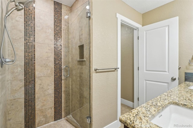 4293 Graham Ct, Boulder, CO 80305 - full bath with a stall shower, double vanity, and baseboards