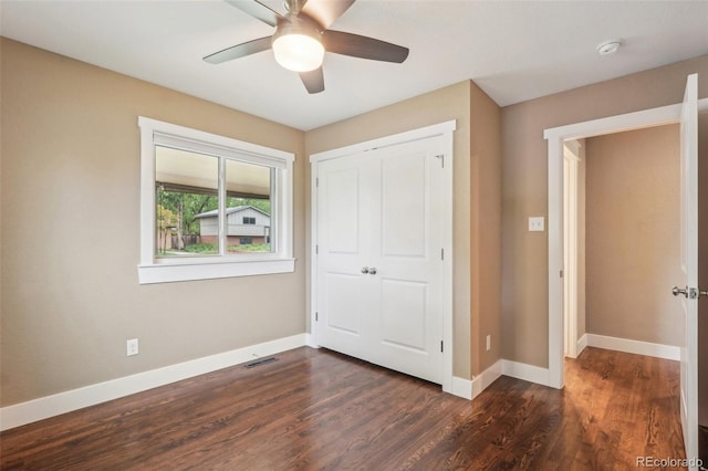 4293 Graham Ct, Boulder, CO 80305 - unfurnished bedroom with dark wood-style flooring, baseboards, a closet, and a ceiling fan