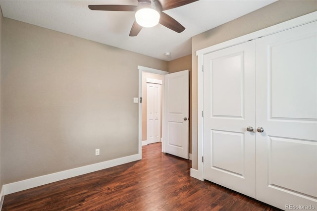 4293 Graham Ct, Boulder, CO 80305 - unfurnished bedroom with baseboards, dark wood-style floors, a closet, and a ceiling fan