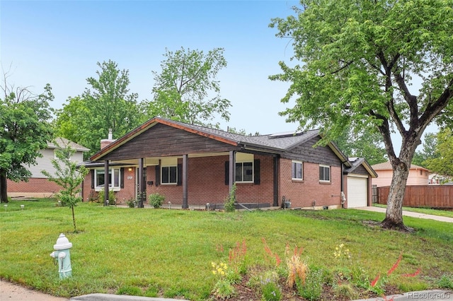 4293 Graham Ct, Boulder, CO 80305 - single story home with solar panels, brick siding, concrete driveway, and an attached garage