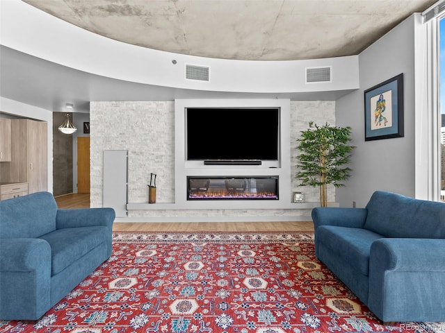 891 14th St Unit 1709, Denver, CO 80202 - living area with wood finished floors and a glass covered fireplace