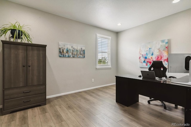 office with recessed lighting, light wood-style floors, and baseboards